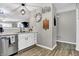Charming kitchen with stainless appliances, white cabinets, and open layout at 828 Ashton Park Dr, Greenwood, IN 46143