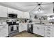 Well-equipped kitchen with stainless appliances and white cabinetry at 828 Ashton Park Dr, Greenwood, IN 46143