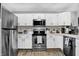 Spacious kitchen with stainless steel appliances and white cabinets at 828 Ashton Park Dr, Greenwood, IN 46143