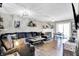 Comfortable living room featuring a large sectional sofa, stylish decor, and ample natural light, perfect for relaxation and gatherings at 828 Ashton Park Dr, Greenwood, IN 46143
