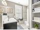 Stylish bathroom featuring a dual vanity, tile shower, and decorative accents at 1019 Central Ave, Indianapolis, IN 46202