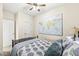 Comfortable bedroom featuring a world map wall decoration and a black metal bed frame at 1019 Central Ave, Indianapolis, IN 46202