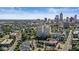 Distant aerial view of a cityscape nestled among verdant trees and buildings in a vibrant area at 1019 Central Ave, Indianapolis, IN 46202