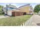 Residential home featuring an exterior with a well-kept lawn and a wooden privacy fence at 1019 Central Ave, Indianapolis, IN 46202