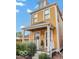 Charming yellow two-story home with a cozy front porch and well-maintained landscaping at 1019 Central Ave, Indianapolis, IN 46202