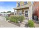 Charming two-story home with inviting front porch and decorative landscaping and porch swing at 1019 Central Ave, Indianapolis, IN 46202