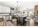 Open concept kitchen with stainless steel appliances, wooden counters, an island, and dark wood flooring at 1019 Central Ave, Indianapolis, IN 46202