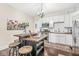 Bright kitchen with butcher block island, white cabinets, stainless appliances, and modern lighting at 1019 Central Ave, Indianapolis, IN 46202