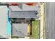 Birds eye view of rear exterior with patio, deck, gravel, lawn, and wooden fence at 1019 Central Ave, Indianapolis, IN 46202