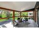 Spacious covered patio with outdoor furniture and wooded view at 22 W 54Th St, Indianapolis, IN 46208