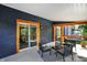 Relaxing back porch with wicker furniture and outdoor lighting at 22 W 54Th St, Indianapolis, IN 46208