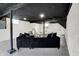 Finished basement with painted ceiling, neutral carpet, and sofa at 22 W 54Th St, Indianapolis, IN 46208