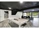 Expansive basement with unique ceiling, pool table, seating area, and garage door access at 22 W 54Th St, Indianapolis, IN 46208