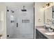 Modern bathroom featuring a glass-enclosed shower with rainfall shower head and built-in niche at 22 W 54Th St, Indianapolis, IN 46208