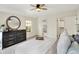Bedroom features white comforter, carpet flooring, a dresser, and a full ensuite for comfort and convenience at 22 W 54Th St, Indianapolis, IN 46208