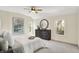 Bedroom features natural light, carpet flooring, neutral colors, a dresser, and art pieces, for a calm and inviting space at 22 W 54Th St, Indianapolis, IN 46208
