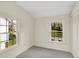 Empty bedroom with two large windows that let in plenty of natural light at 22 W 54Th St, Indianapolis, IN 46208