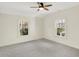 Well-lit bedroom featuring neutral walls and carpet and two windows at 22 W 54Th St, Indianapolis, IN 46208