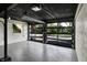 Spacious garage with glass door and painted ceiling providing plenty of natural light at 22 W 54Th St, Indianapolis, IN 46208