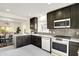 Updated kitchen showcases dark wood cabinets, stainless appliances, and white countertop at 22 W 54Th St, Indianapolis, IN 46208
