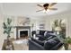 Comfortable living room featuring stylish sofas, a fireplace, hardwood floors, and abundant natural light at 22 W 54Th St, Indianapolis, IN 46208