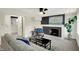Comfortable living room with painted brick fireplace, stylish decor, and open layout to other areas at 22 W 54Th St, Indianapolis, IN 46208