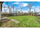 Spacious backyard with grass, shed and blue sky at 120 Hugo St, Indianapolis, IN 46229