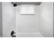 Shower featuring subway tile and dark fixtures at 120 Hugo St, Indianapolis, IN 46229
