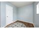 Bedroom featuring wood floors, natural light, and a door at 120 Hugo St, Indianapolis, IN 46229