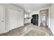 Open kitchen featuring white cabinets, stainless steel appliances, and modern flooring at 120 Hugo St, Indianapolis, IN 46229