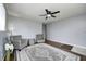 Spacious living room featuring hardwood floors, grey walls, comfortable seating, and a view of the outside at 120 Hugo St, Indianapolis, IN 46229