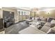 Spacious basement with sectional sofa and built-in shelving at 6996 N Washington Blvd, Indianapolis, IN 46220
