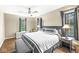 King bedroom with hardwood floors and large windows at 6996 N Washington Blvd, Indianapolis, IN 46220