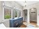 Entryway with hardwood floors, built-in storage, and natural light at 6996 N Washington Blvd, Indianapolis, IN 46220