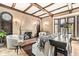 Living room with hardwood floors, fireplace, and beamed ceiling at 6996 N Washington Blvd, Indianapolis, IN 46220