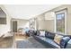 Comfortable living room with leather sofa and large windows at 6996 N Washington Blvd, Indianapolis, IN 46220