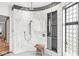 Curved glass shower with multiple shower heads and bench at 6996 N Washington Blvd, Indianapolis, IN 46220