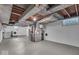 Unfinished basement with utilities, laundry, and concrete floors at 4807 Graceland Ave, Indianapolis, IN 46208
