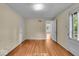 Bedroom featuring refinished hardwood floors and natural light at 4807 Graceland Ave, Indianapolis, IN 46208