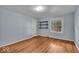 Bedroom featuring hardwood floors, natural light, and built in shelves at 4807 Graceland Ave, Indianapolis, IN 46208