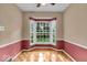 Cozy sitting room with a bay window and two-toned paint on the walls at 4807 Graceland Ave, Indianapolis, IN 46208