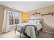 Cozy bedroom features a large window, neutral decor, and floating shelves at 8418 Mesic Ct, Indianapolis, IN 46278