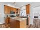 Bright kitchen boasts granite countertops, stainless steel appliances, and a center island with seating at 8418 Mesic Ct, Indianapolis, IN 46278