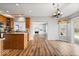 Open concept kitchen connects to a dining area and living room with fireplace at 8418 Mesic Ct, Indianapolis, IN 46278