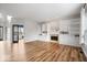 Bright, open living room featuring a fireplace, built-in bookcases, and wood floors at 8418 Mesic Ct, Indianapolis, IN 46278