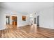 Spacious living area with hardwood floors, open concept to kitchen, and natural light at 8418 Mesic Ct, Indianapolis, IN 46278