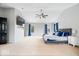 A large primary bedroom featuring vaulted ceilings, a ceiling fan, and soft neutral carpeting at 8418 Mesic Ct, Indianapolis, IN 46278