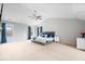 Spacious primary bedroom features vaulted ceilings, large windows, and neutral carpeting at 8418 Mesic Ct, Indianapolis, IN 46278