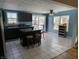 Kitchen with dark cabinets, an island, and tiled floor at 108 W 650 South, Pendleton, IN 46064