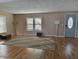 Bright living room featuring hardwood floors and a large area rug at 108 W 650 South, Pendleton, IN 46064